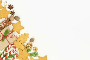 Christmas background with gift boxes and gingerbread cookies photo