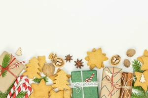 Christmas background with gift boxes and gingerbread cookies photo