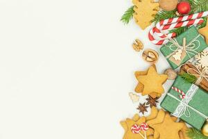 Christmas background with gift boxes and gingerbread cookies photo