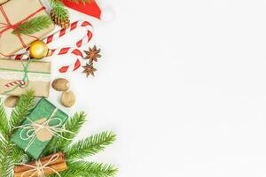 Christmas background with gift boxes, candies, spruce photo