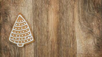 Concept Gingerbread Christmas tree on the wooden background photo