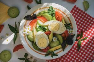 Breakfast with egg and vegetable salad photo