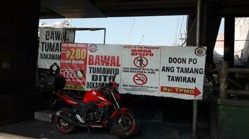 Manila, Philippines on April 8, 2019. Banner or public service banner on the side of the road in Manila, photo