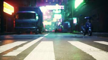 A vibrant city street illuminated by the lights of the night photo