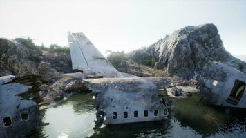 Destroyed aircraft on rugged island coast photo