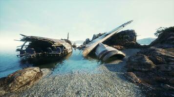 Ruined plane on rocky island coastline photo