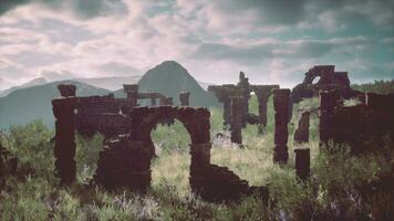 Ruined castle standing tall on rocky hillsides photo