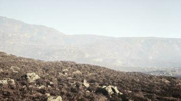 misty daybreak on a mountain plateau between rocky peaks photo