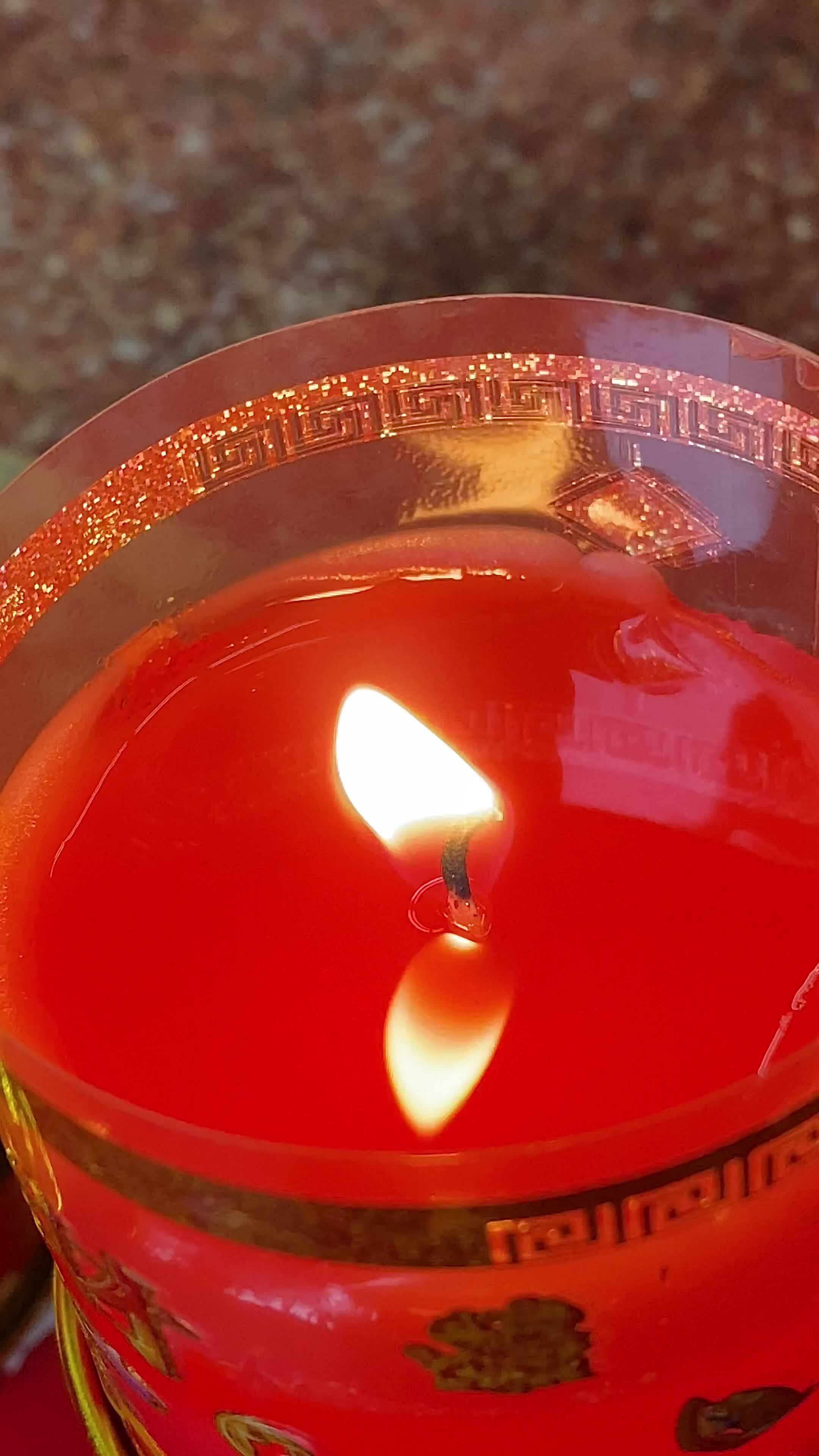 Flames under candlelight for worshiping sacred objects according to