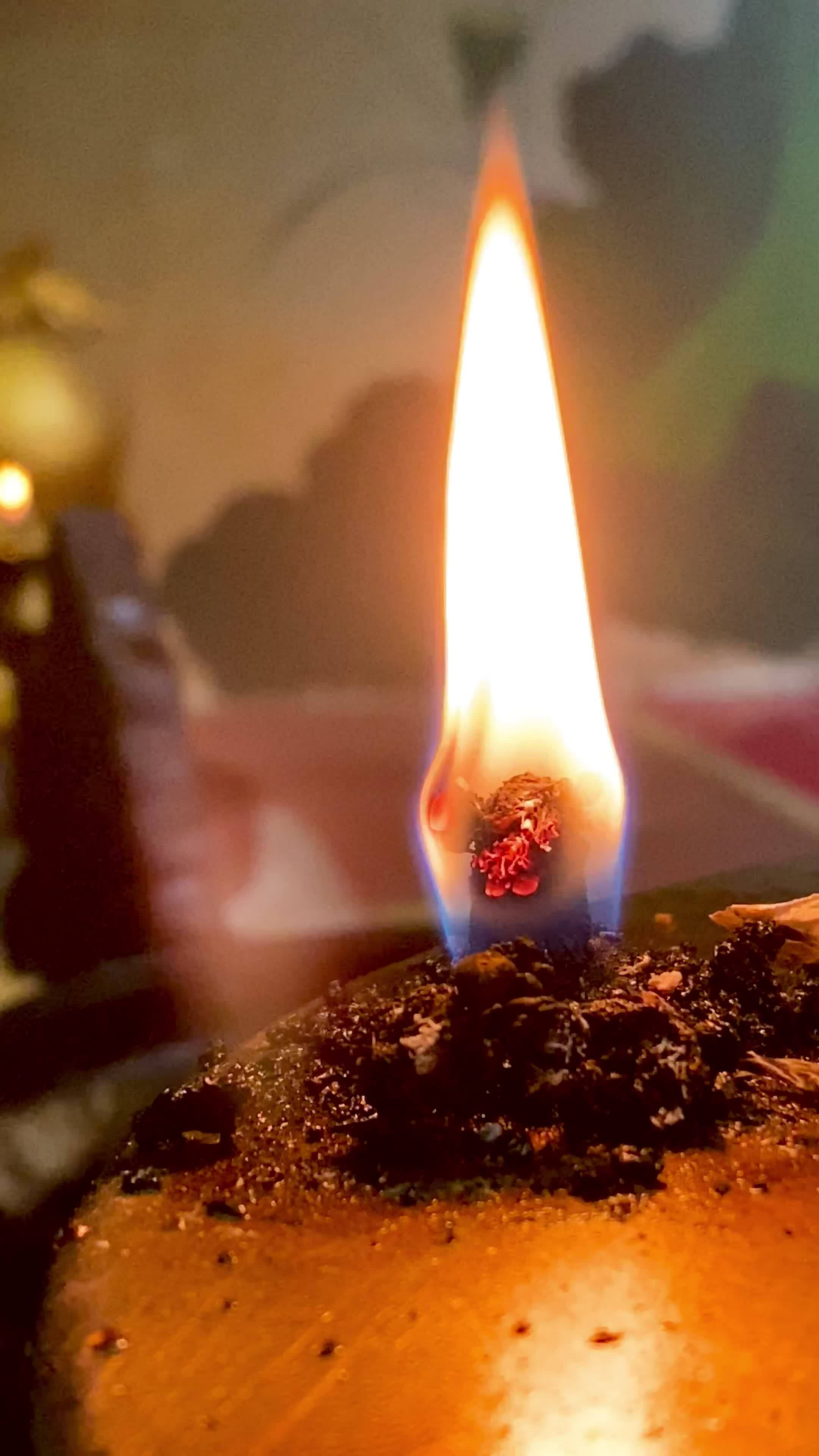 Flames under candlelight for worshiping sacred objects according to