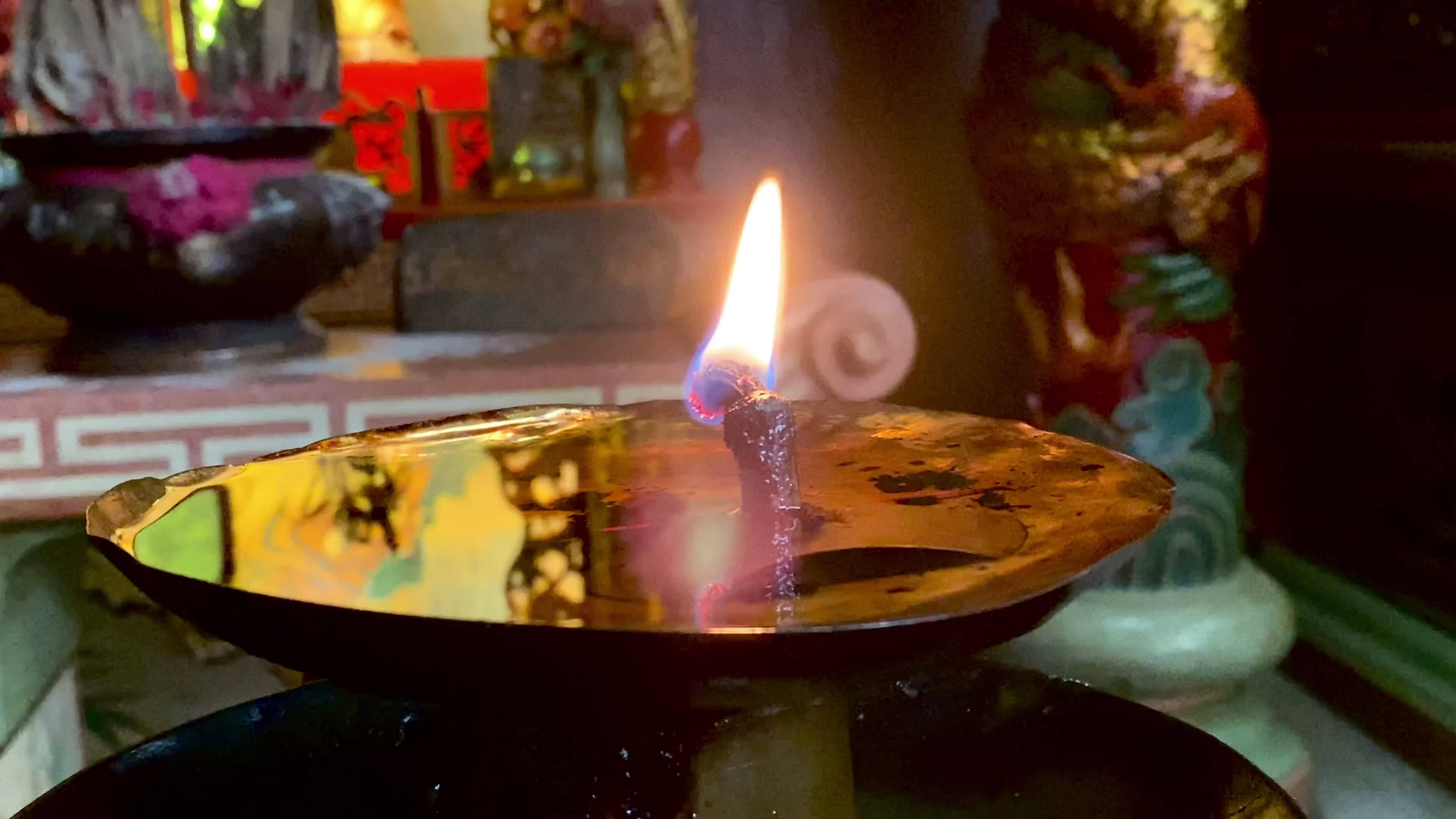 Flames under candlelight for worshiping sacred objects according to