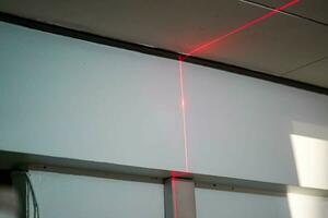 Laser rangefinder in home renovation work photo