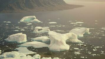 Icebergs floating on water photo