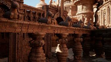 A group of statues displayed on a wooden table in a temple photo