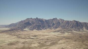 An aerial view of a mountain range in the desert photo