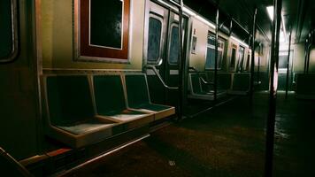 An empty subway car in a dimly lit metro station photo
