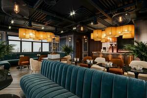Modern restaurant interior with an industrial style and luxurious furniture. photo