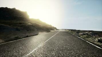 Scenic view of empty road amidst volcanic landscape photo