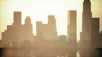 Beautiful sun ray over downtown during hazy sunrise photo