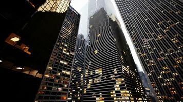 A city skyline illuminated at night with towering buildings photo