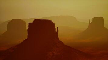 Sunset at the sisters in Monument Valley photo