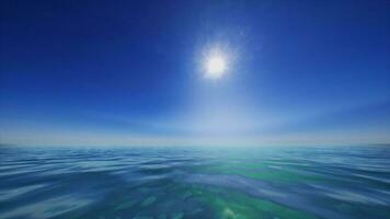 The sun is shining over the ocean water photo