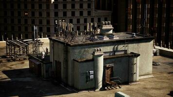 A building with a complex network of electrical equipment on its roof photo