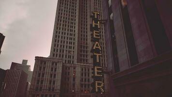 A tall building with a prominent Theatre sign photo