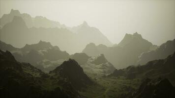 A misty mountain range in the fog photo