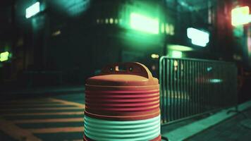 A red and white trash can sitting on the side of a road photo