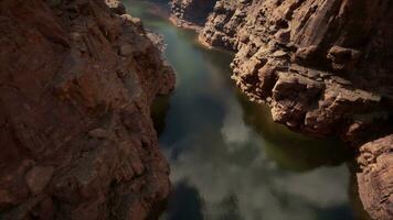 bird's-eye view of a majestic river flowing through a stunning canyon landscape photo