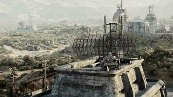 A man overlooking a forest from a military base war bunker photo