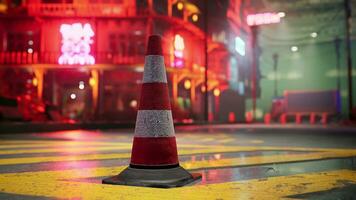 A red and white traffic cone sitting on top of a street photo