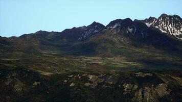 A breathtaking mountain range under a clear blue sky photo