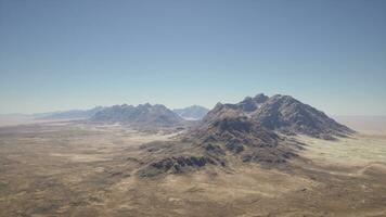 An aerial view of a mountain range in the desert photo