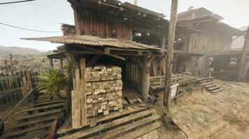 An ancient wooden house with a rustic wooden roof photo