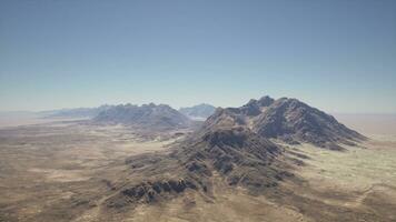 An aerial view of a mountain range in the desert photo