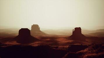 A stunning desert landscape with prominent rock formations photo