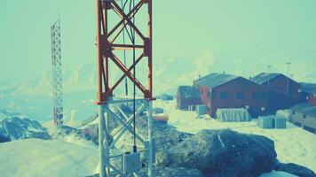 antarctic base set in a natural harbor in front of the Antarctic Peninsula photo