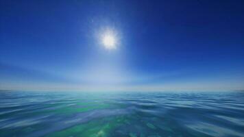 The sun is shining over the ocean water photo