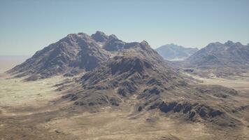 An aerial view of a mountain range in the desert photo