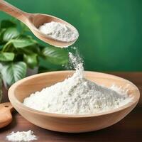 Collagen powder in wooden bowl on natural green background. AI Generated photo