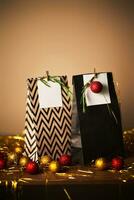 Christmas gift bags with decor and Christmas ornament. photo