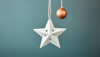 Christmas ornament hanging on a blue background, symbol of celebration generated by AI photo