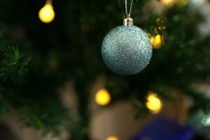 Merry Christmas 2024 concept Christmas balls are used to decorate the Christmas tree at family parties. photo