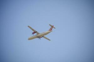 New Delhi, India, April 16 2023 - Private Jet take off from Indra Gandhi International Airport Delhi, Compact plane domestic aeroplane flying in the blue sky during day time photo