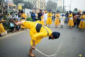 Delhi, India, October 2, 2023 - Sikhs display gatka and martial arts during annual Nagar Kirtan, Traditional, procession on account of birthday of Guru Nanak Dev ji, Nagar Kirtan in East Delhi area photo