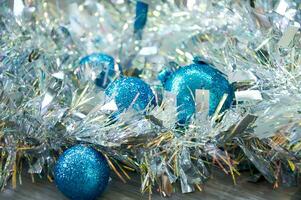 Blue Christmas balls in silver tinsel. Christmas background photo