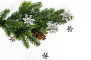 Christmas background. Fir branches with decorations on a white background photo