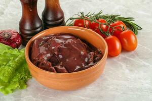 Raw turkey liver in a bowl ready for cooking photo